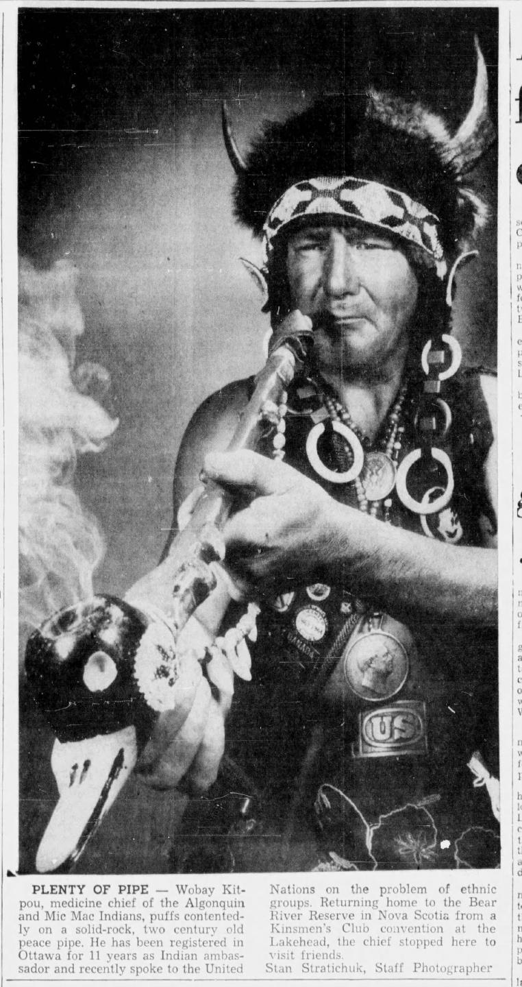 Kitpou is pictured here with the allegedly centuries-old pipe that he claimed was once smoked by Queen Victoria. The belt buckle with "US" is claimed to be from Custer's Last Stand.